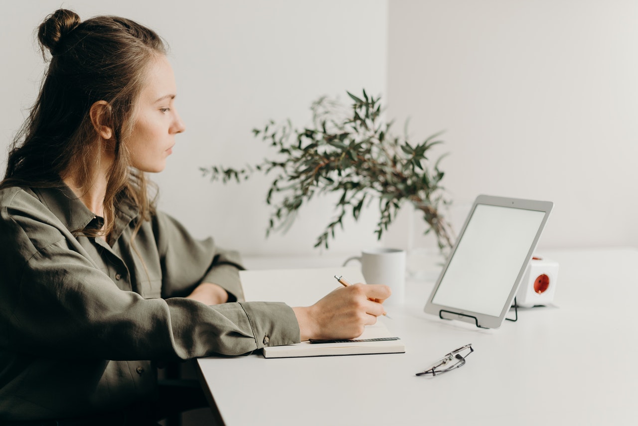 Young professional focused on computer, demonstrating productivity